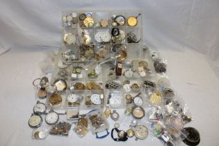 Various pocket watch parts including faces, part cases, movements,