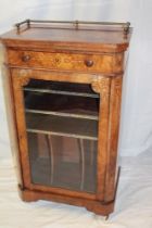 A Victorian inlaid burr walnut music cabinet with a single-drawer in the frieze and leather mounted