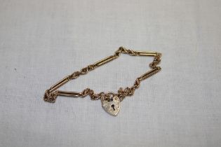 A 9ct gold multi-link bracelet with 9ct gold padlock clasp (6.