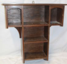 An Edwardian oak hanging wall shelf,