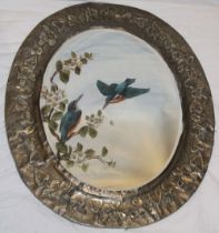 An unusual bevelled oval wall mirror with painted kingfisher and floral decoration within pewter