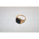 A 15ct gold signet ring set intaglio seal (6.