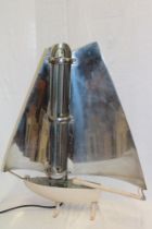 A 1950's/60's Art Deco-style heater in the form of a yacht with chromium plated and painted