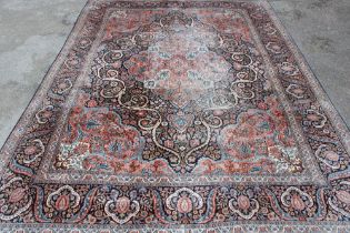 A good quality wool rug with floral decoration,