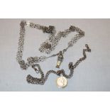 A silver pocket watch chain with silver coin fob and an Eastern silvered filigree necklace (2)