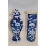 A late 19th century Chinese baluster-shaped vase with cover with blue and white blossom decoration