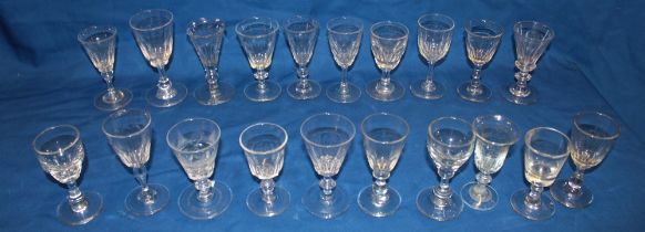 A selection of 18th and 19th century stemmed drinking glasses of similar form with tapered stems