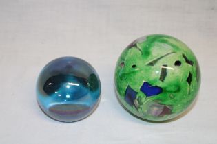 A spherical glass paperweight,