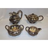An unusual George IV silver tea and coffee set comprising circular pedestal coffee pot with