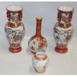 A pair of Japanese Kutani pottery baluster-shaped two-handled vases with painted bird and floral