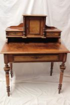 A late 19th century figured walnut writing desk with a single drawer in the frieze below central