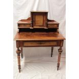 A late 19th century figured walnut writing desk with a single drawer in the frieze below central