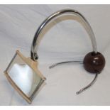 A 1930's chromium-plated and painted metal table magnifier with weighted base