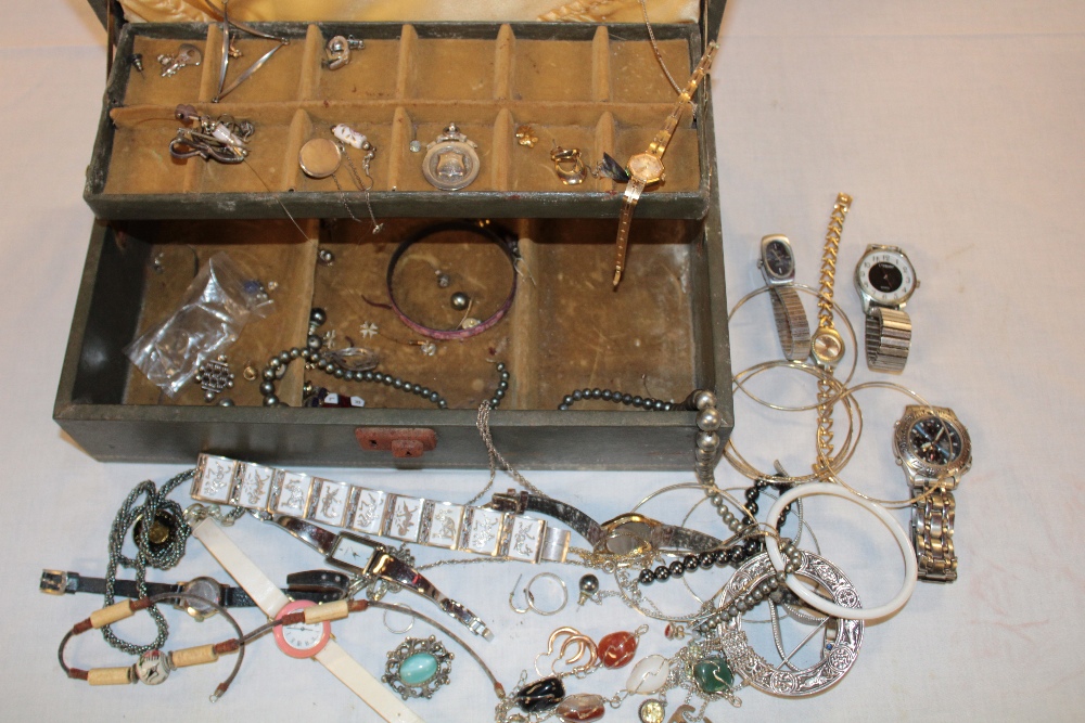 A jewellery box containing a quantity of various costume jewellery including earrings, necklaces,