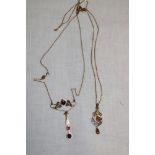 A 9ct gold Art Nouveau-style pendant necklace set garnet and pearls and one other similar pendant