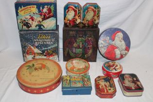 A selection of vintage Christmas decorated tins including Elkes Assorted Biscuits,