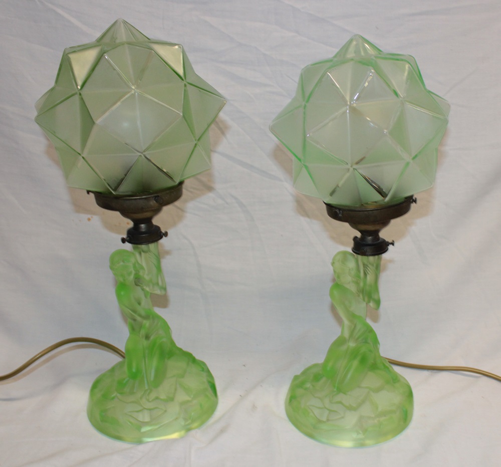 A pair of 1930's/40's Art Deco-style green tinted glass table lamps in the form of kneeling nude