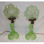 A pair of 1930's/40's Art Deco-style green tinted glass table lamps in the form of kneeling nude