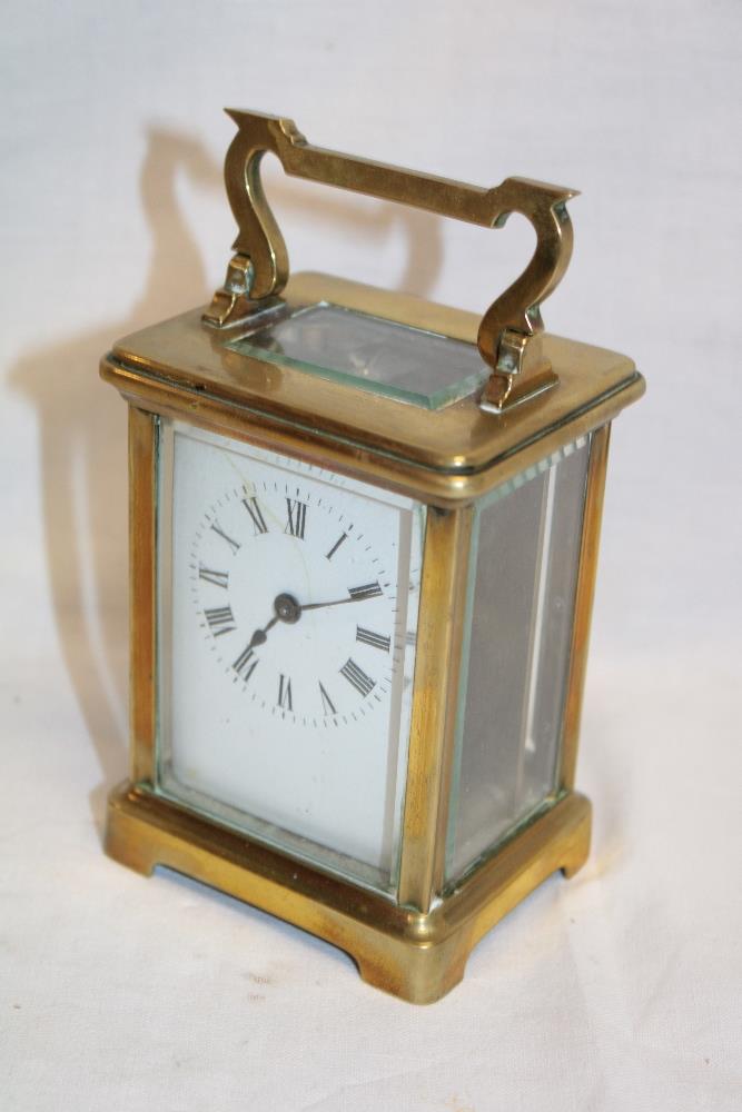 A French carriage clock with rectangular enamelled dial in brass traditional glazed case