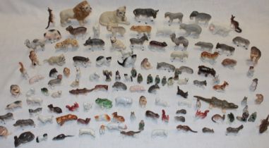 A large selection of various miniature china animals and figures including zoo animals,