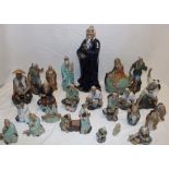 A selection of Eastern glazed terracotta figures of male characters including a 15" character in