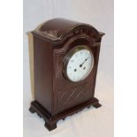 A good quality brass mounted mahogany arched mantel clock by Maple and Co.