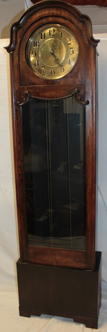 A 1920's/30's grandfather clock with brass circular dial in oak glazed arched traditional case - Image 2 of 3