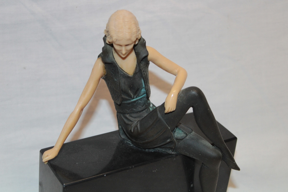 A modern Art Deco-style bronzed spelter figure of a seated female with composition arms and head on - Image 2 of 2