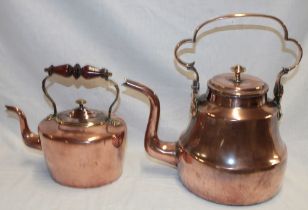 A Georgian copper tapered kettle with scroll handle and a Victorian copper oval kettle with turned