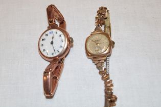 A ladies 9ct gold wristwatch with 9ct gold mounted strap and one other ladies' 9ct gold wristwatch