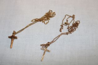 Two various 9ct gold crucifix pendant necklaces (5.