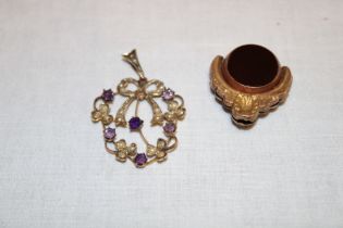 A 9ct gold pendant set amethyst and seed pearls and a 9ct gold mounted swivel fob (2)