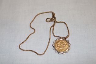 A 9ct gold pendant necklace mounted with an Edward VII 1902 gold half sovereign (9.