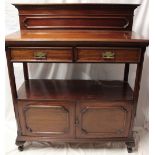 A Victorian walnut two-tier buffet with two drawers in the frieze and cupboard enclosed by two