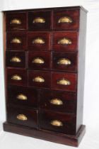 A 19th century mahogany bank of sixteen drawers with brass arched handles,
