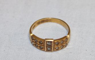 An 18ct gold dress ring with rectangular panels set 14 diamonds (3.