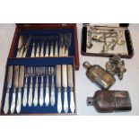 A set of twelve electroplated tea knives and forks with mother-of-pearl handles in lined mahogany