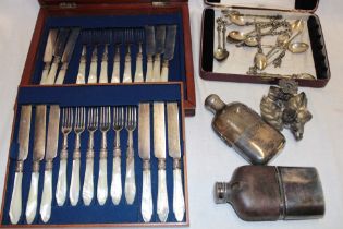 A set of twelve electroplated tea knives and forks with mother-of-pearl handles in lined mahogany