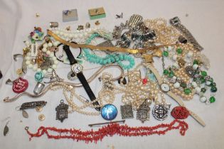 A quantity of various costume jewellery including necklaces, brooches, wristwatches,