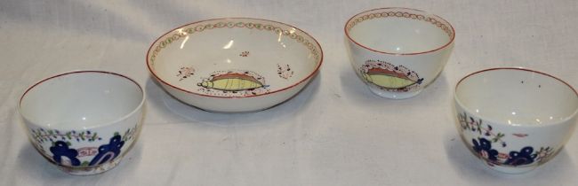 An 18th century china tea bowl and saucer with painted shell decoration and two other 18th century