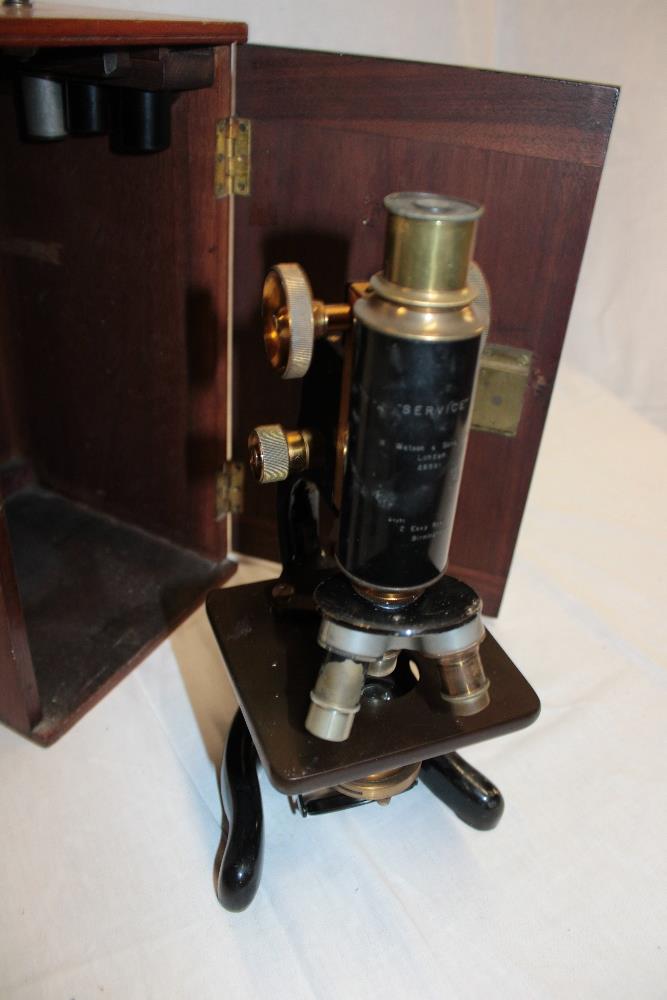 A brass and painted metal monocular (service) microscope by Watson & Sons Limited London in fitted - Image 2 of 2