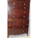 A George III mahogany chest on chest, the base with three long graduated drawers and brushing slide,