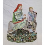 A 19th century Pearlware china figure of Mary and Child on a donkey being led by Joseph,