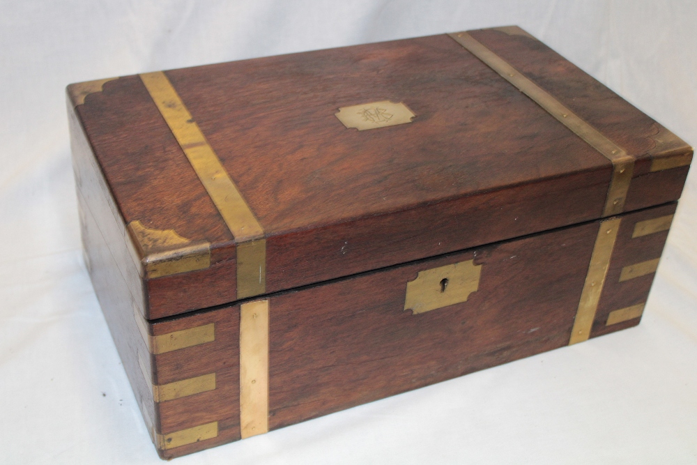 A Victorian brass mounted rosewood rectangular writing slope with fitted interior and writing