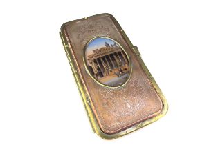 A 19th Century Grand Tour pouch/spectacle case having a brass frame with embossed copper panels to