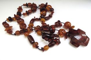 A large bead amber necklace with a large pendant,110cm long, 138g