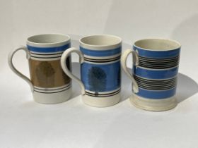 Three Quart Mocha ware tankards, two blue and one pale brown, one cracked, crazing to handle of one,