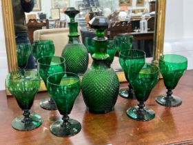 A late 19th Century green facet decanter and six green glasses of large proportions, 15.5cm tall