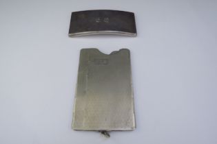 Two card cases one silver example of curved form, 30g and the other with engine turned detail