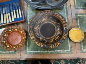 Three Pottery dishes including motto slipware "Comfort me with apples" and "Soroptimist Club of